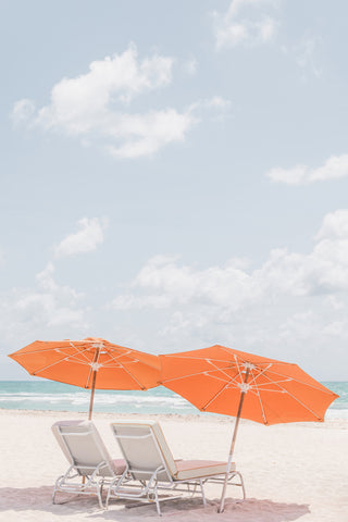 Two Orange Umbrellas on the Beach