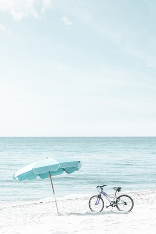 Sun Umbrella and Bicycle on the Beach